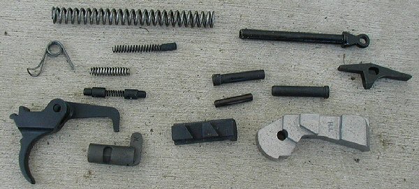 #216 M1 carbine trigger house parts. Everything needed to complete a trigger house including the retaining pin.